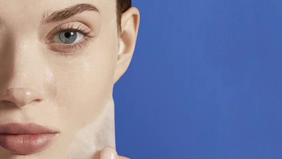 Woman applying a face mask