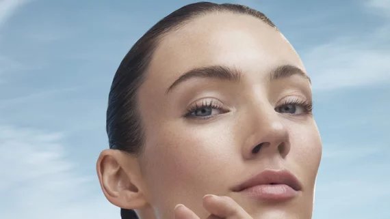 woman doing face yoga massage