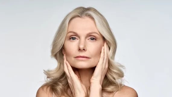 mature woman touching her face