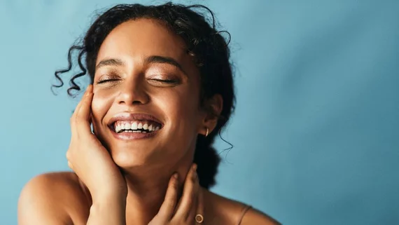 Smiling woman with healthy skin