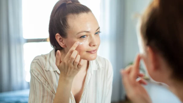 woman applying day cream