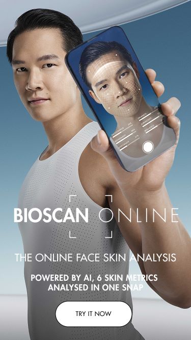man holding a phone showing the bioscan service